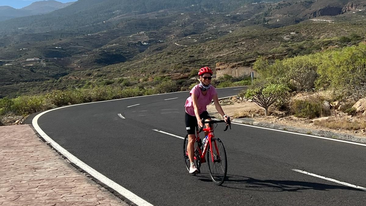 Woman riding on a bike in the mountains